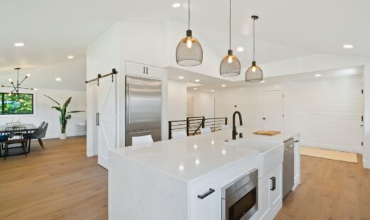 turned on pendant lamps above kitchen island