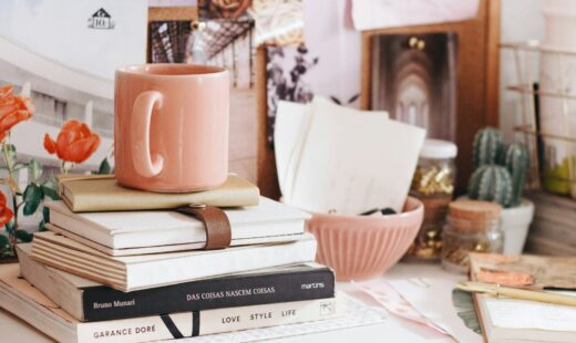 brown ceramic coffee mug on book